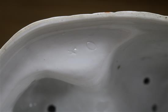 A porcelain figure and two Chinese ornaments